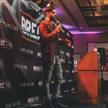 Hooman giving his motivational speech at an event